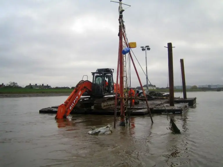 marine demolition excavator removing structure from UK waterways