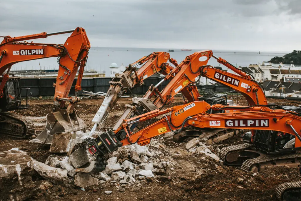 Demolition contractors UK. Excavators clearing commercial demolition site
