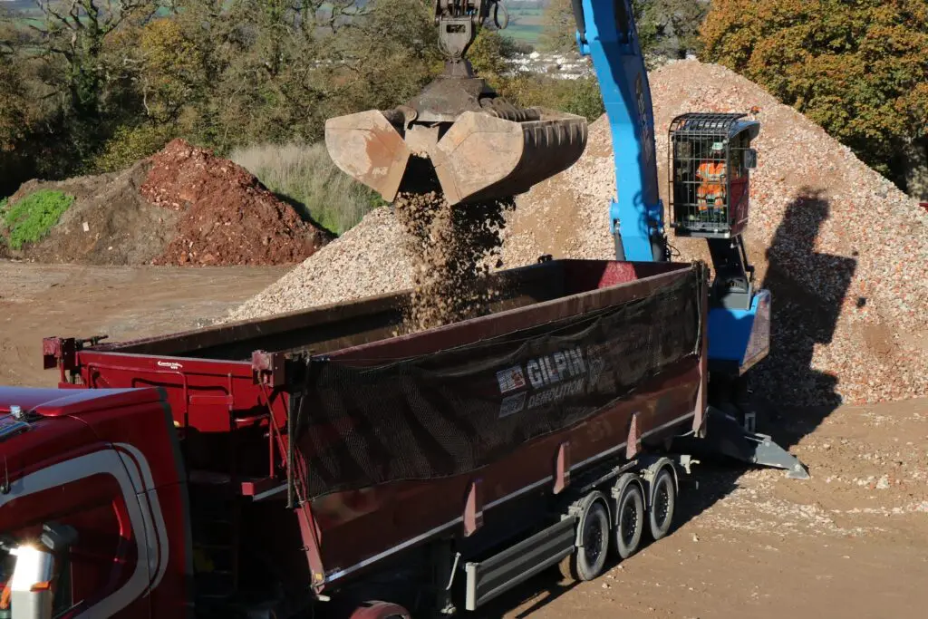machine loading processed recycled crushed aggregate for reuse